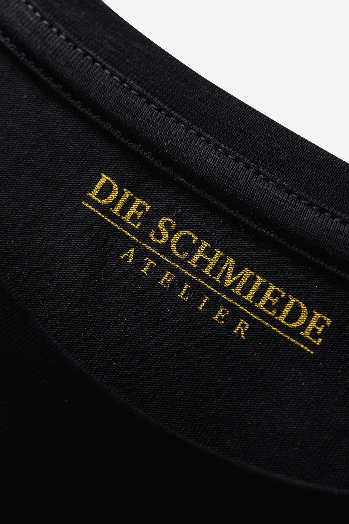 Schwarzes DIE SCHMIEDE Damen T-Shirt aus Baumwolle, langer Schnitt und eng anliegend, vielseitig kombinierbar