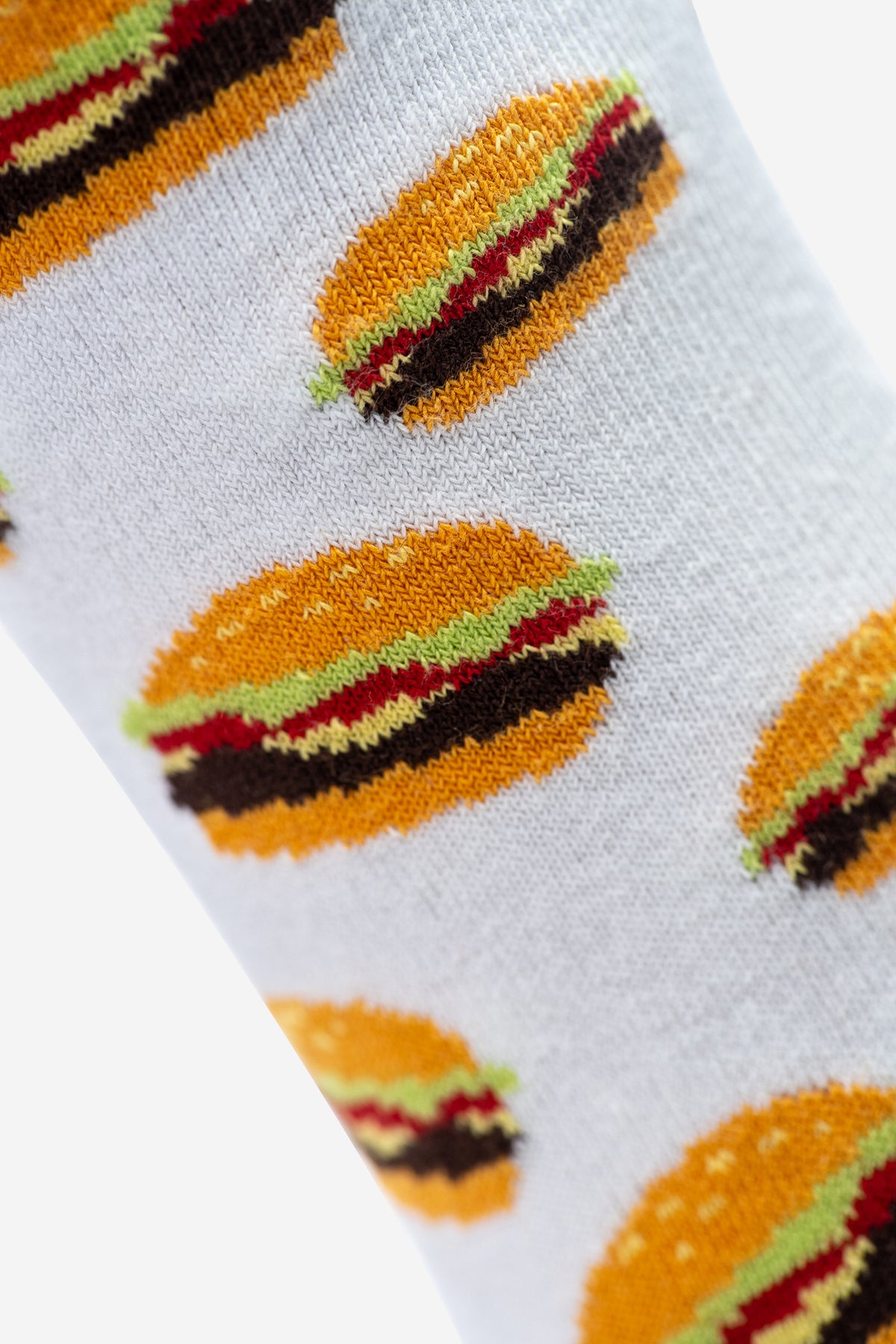 Mittellange, weisse Socken mit Burger-Muster. Vielseitig kombinierbar und ein tolles Geschenk für sie und ihn