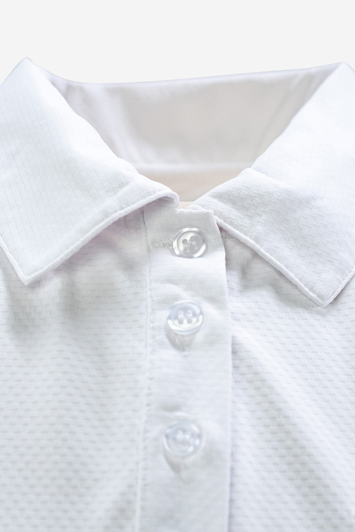 Sleeveless Performance Polo – Weiss