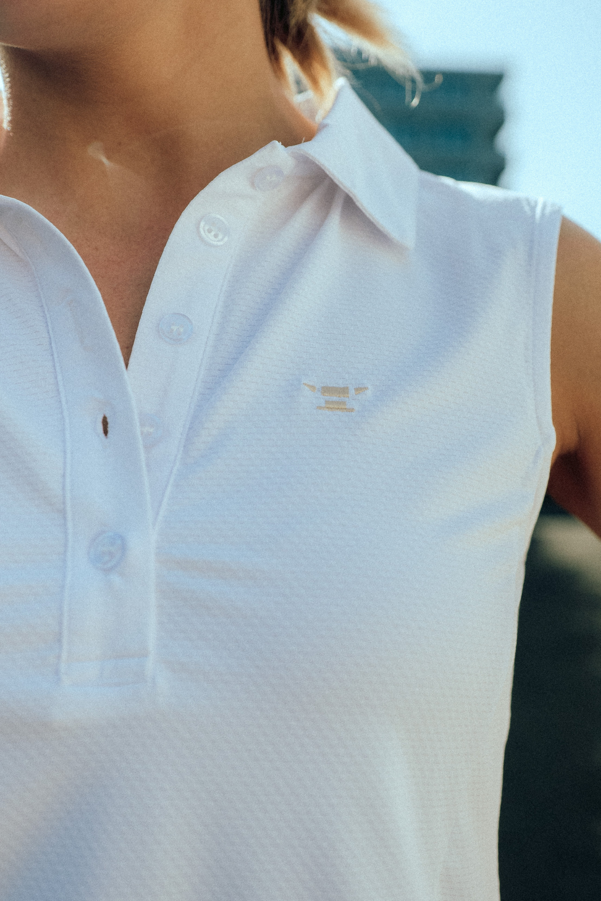Sleeveless Performance Polo – Weiss