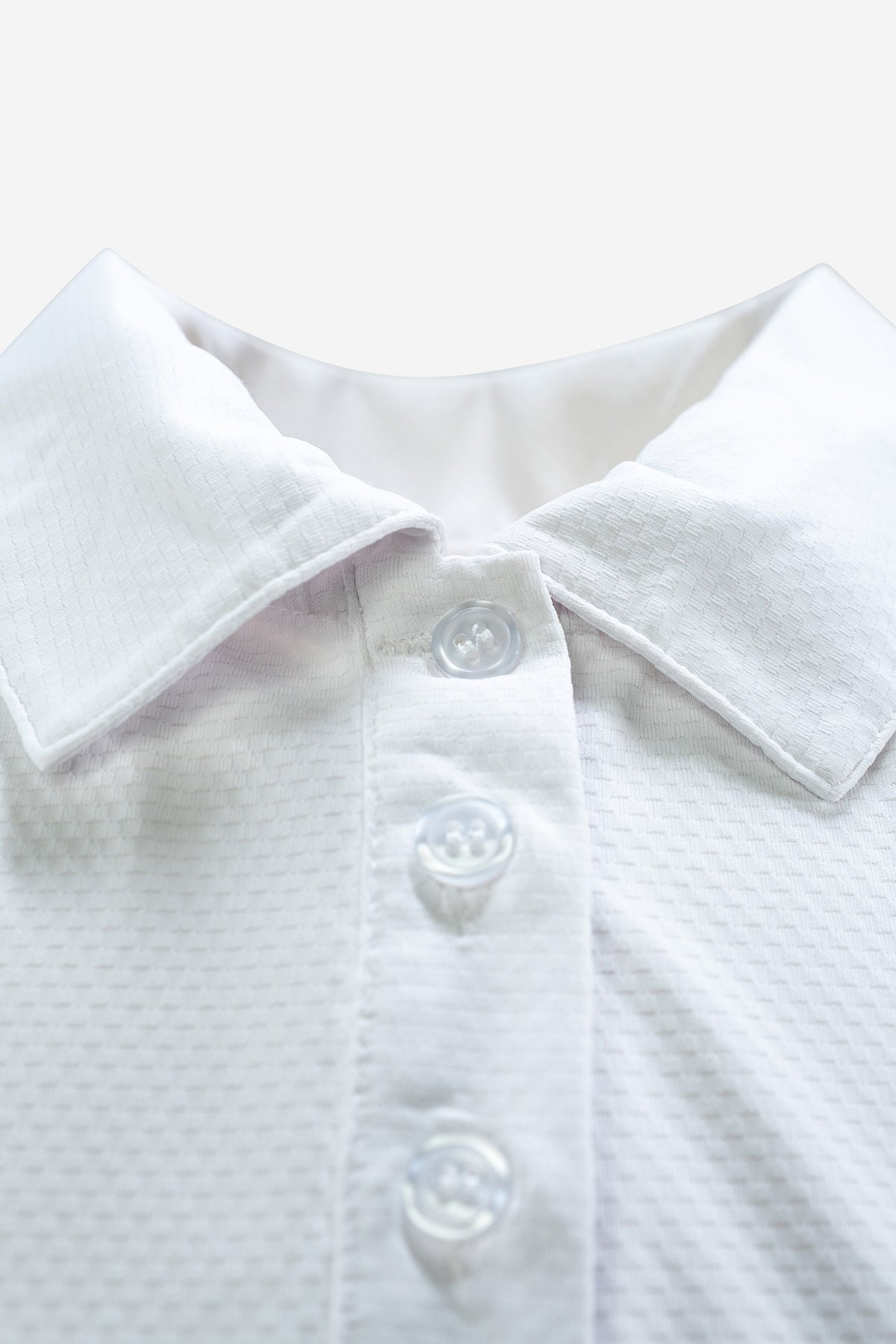 Sleeveless Performance Polo – Weiss